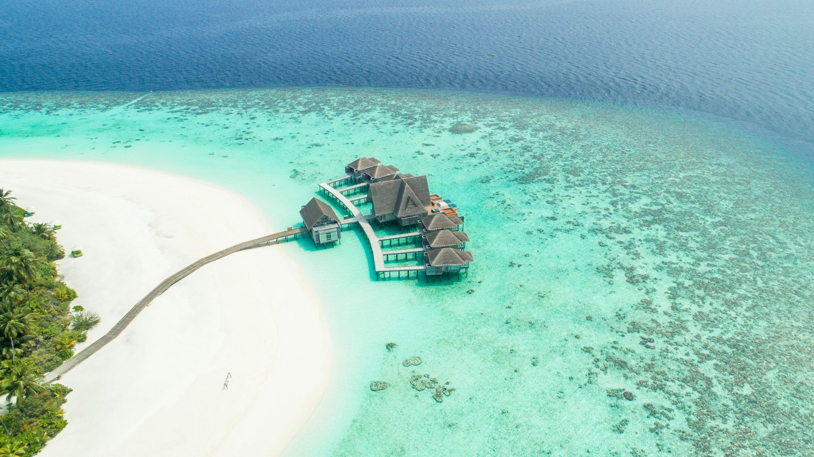 Luxury Maldives overwater resort surrounded by turquoise water