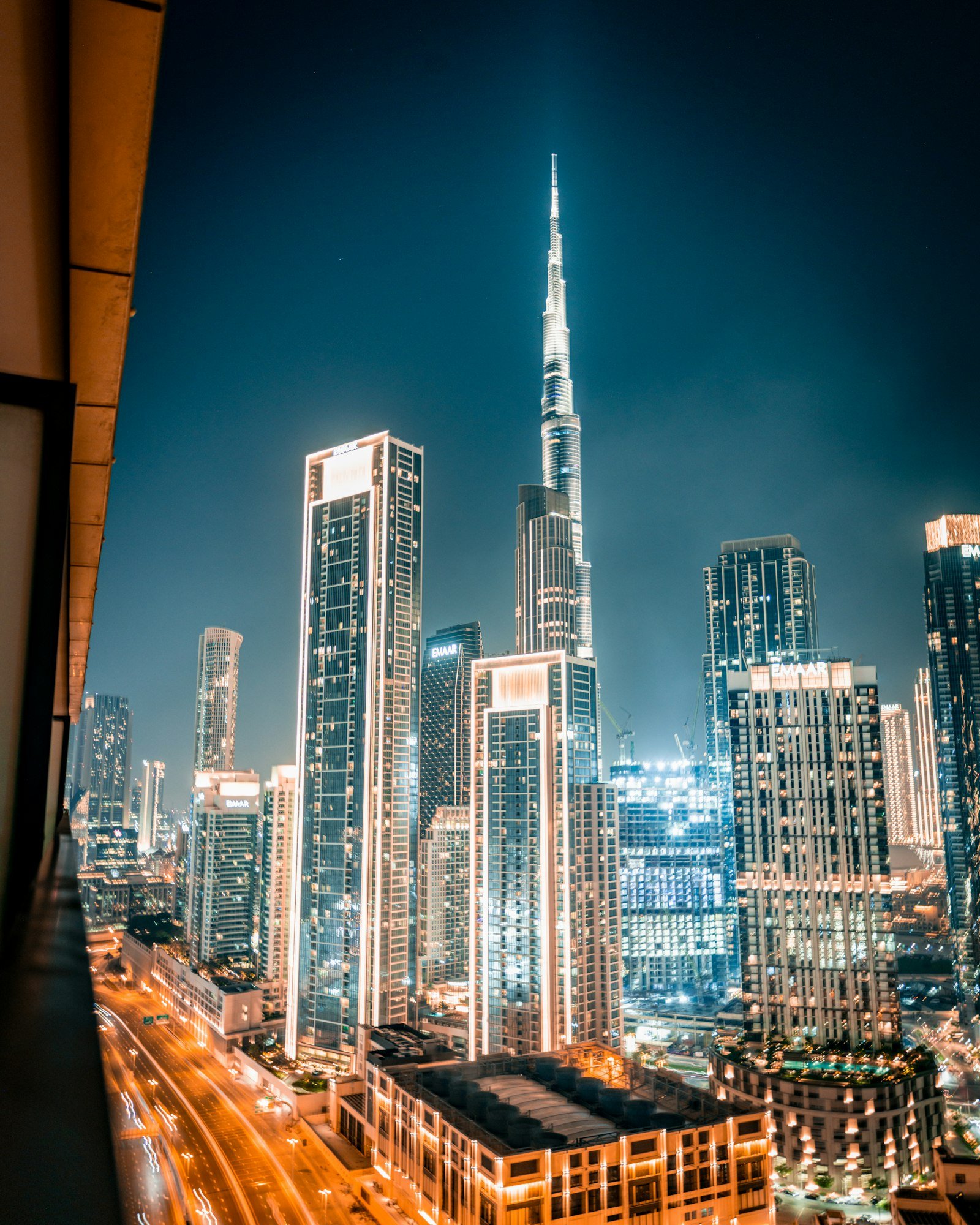Dubai skyline illuminated at night with Burj Khalifa
