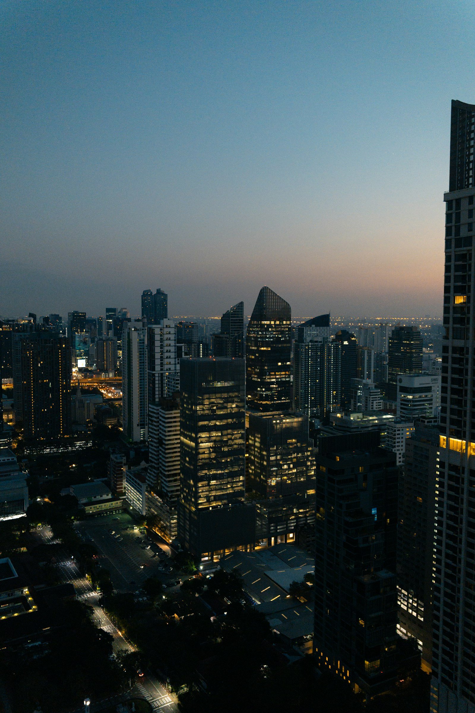 Bangkok skyline illuminated at dusk, Thailand