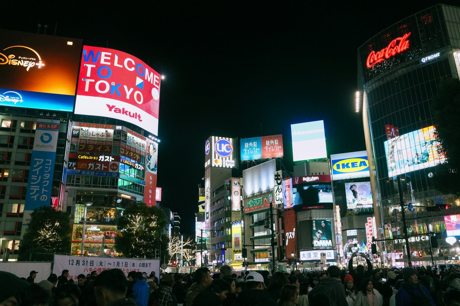 Vibrant Shibuya Crossing illuminated at night in Tokyo, Japan