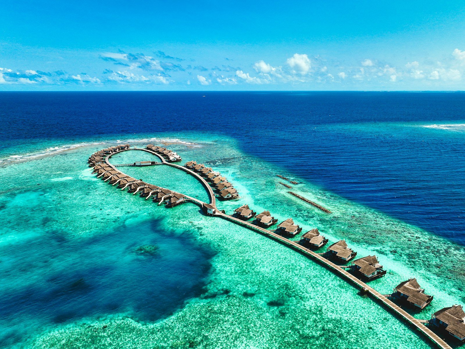 Aerial view of Ozen Reserve Bolifushi and its overwater villas in the Maldives