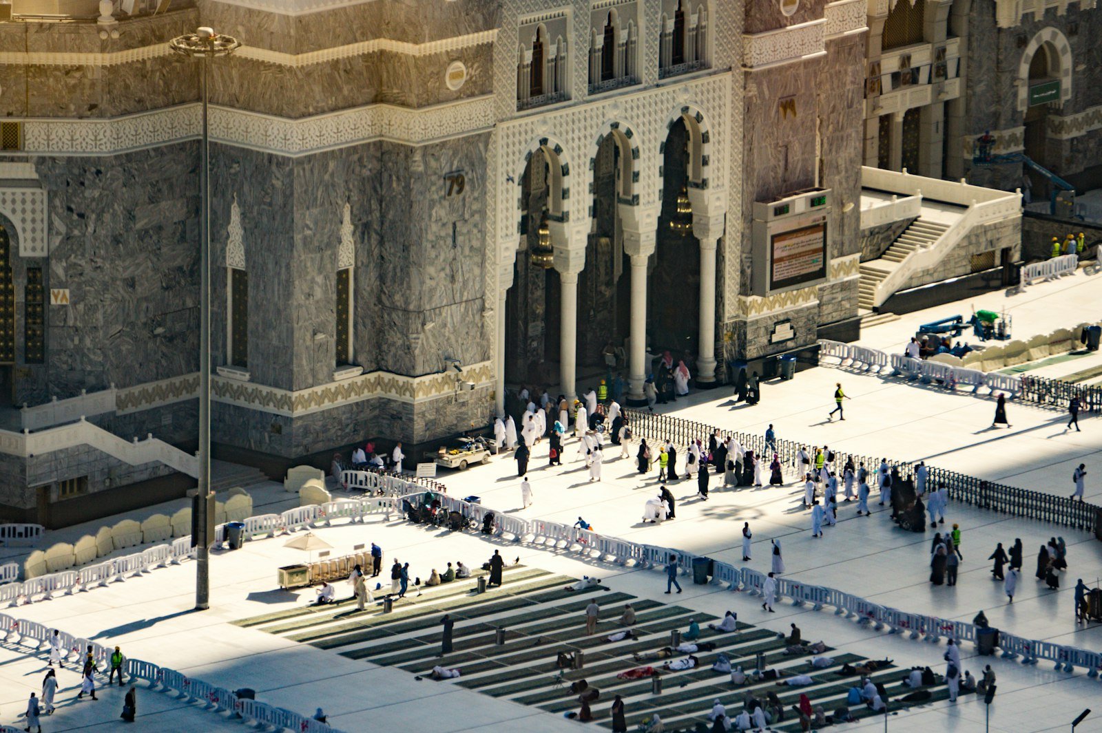 Pilgrims entering the grand courtyard of Masjid al-Haram in Makkah at sunset