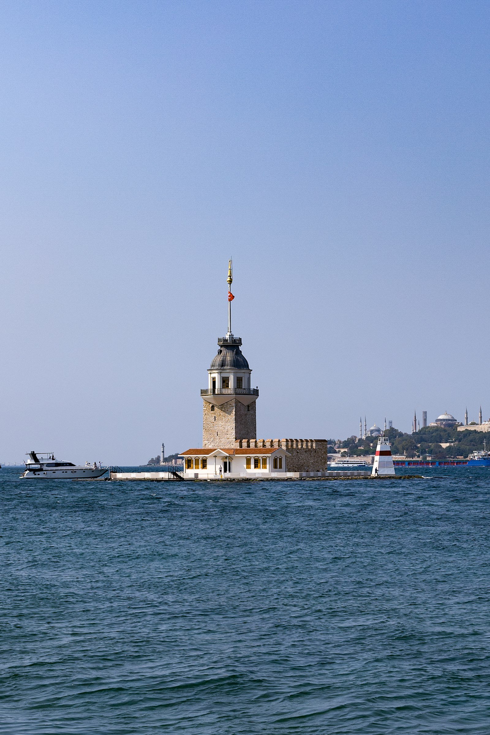 Maiden's Tower standing in turquoise Bosphorus water, Istanbul, Turkey