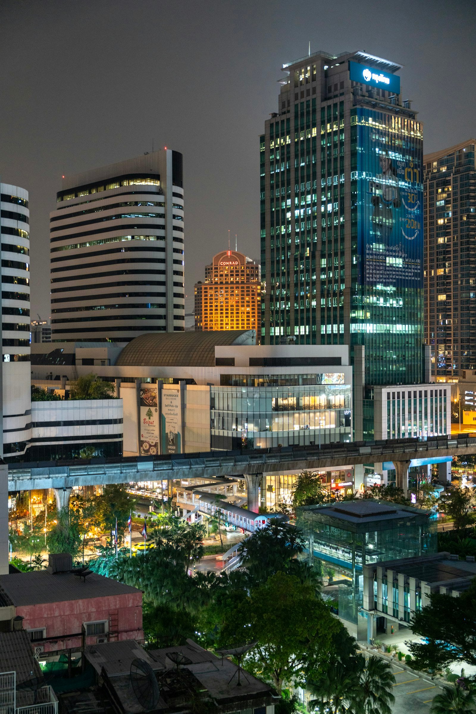 Modern Bangkok skyline illuminated at night, Thailand