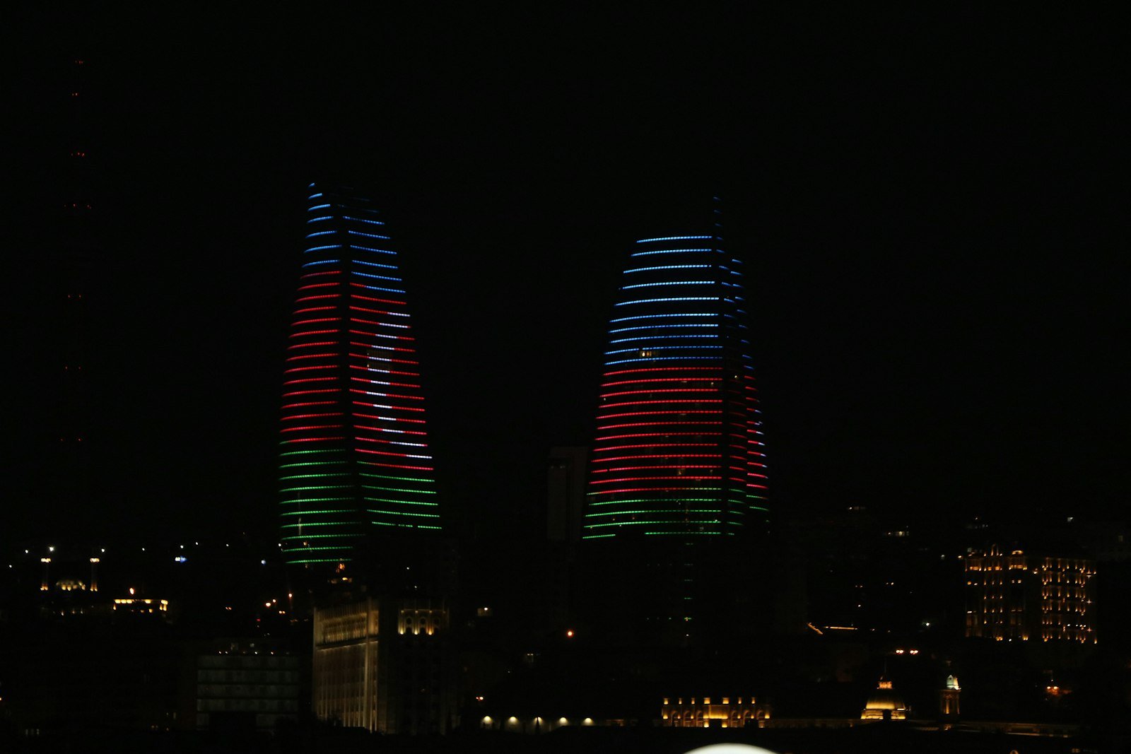 Flame Towers illuminated above Baku at night, Azerbaijan