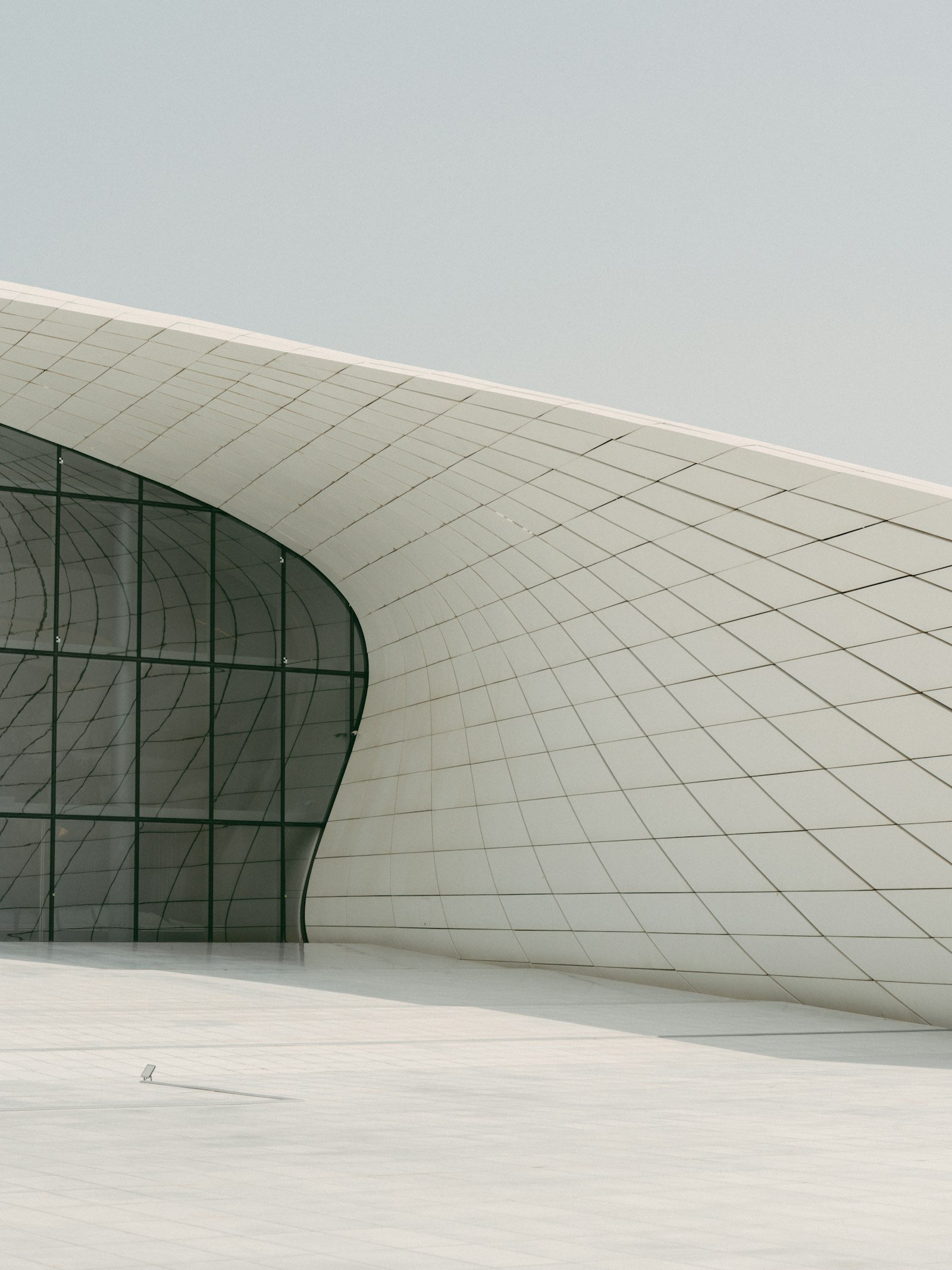 Flowing white architecture of Heydar Aliyev Centre in Baku, Azerbaijan