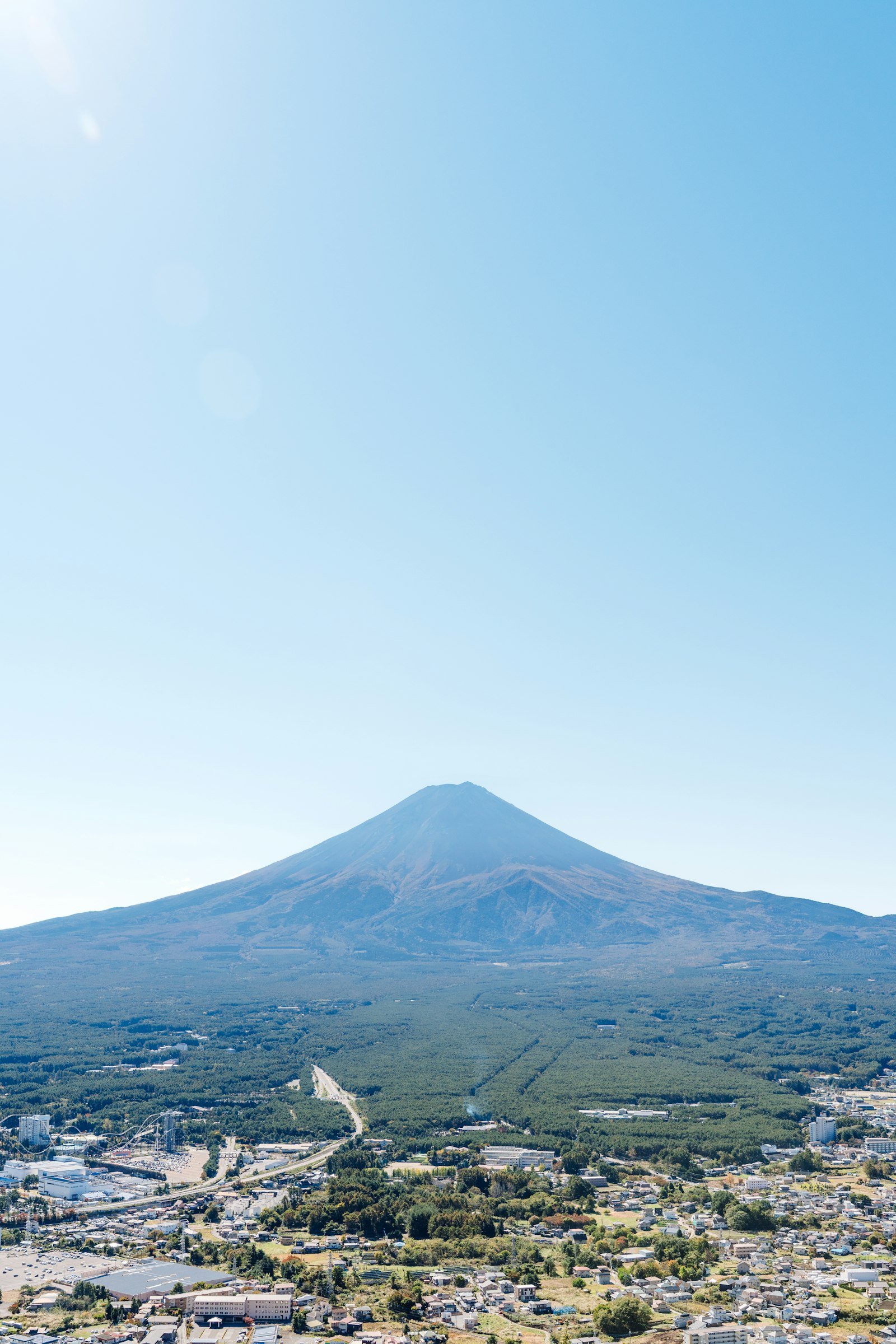 Mount Fuji rising beyond Lake Kawaguchi and a peaceful Japanese town